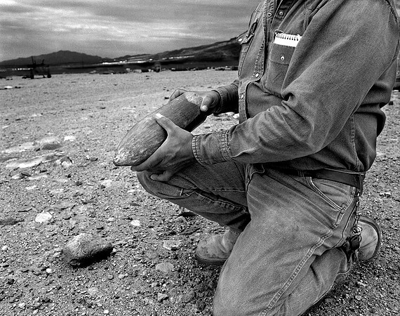 man with earth boring projectile