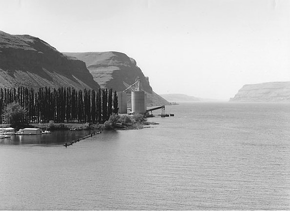 Grain elevators and entrance to Columbia River Gorge, looking west, Lake Wallula, Oregon